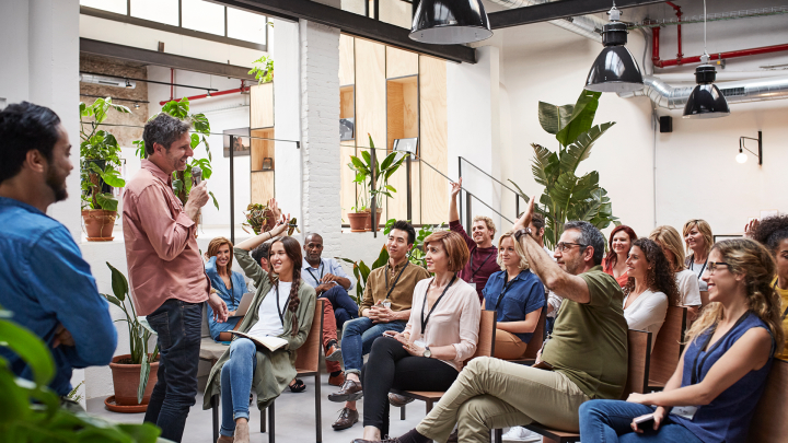 education-group-of-people-at-a-workshop-listening-to-speaker-getty20